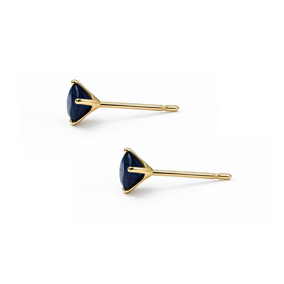 aretes punto de luz con circonita cubica azul de perfil elaborado en oro laminado de AMBAR Joyería