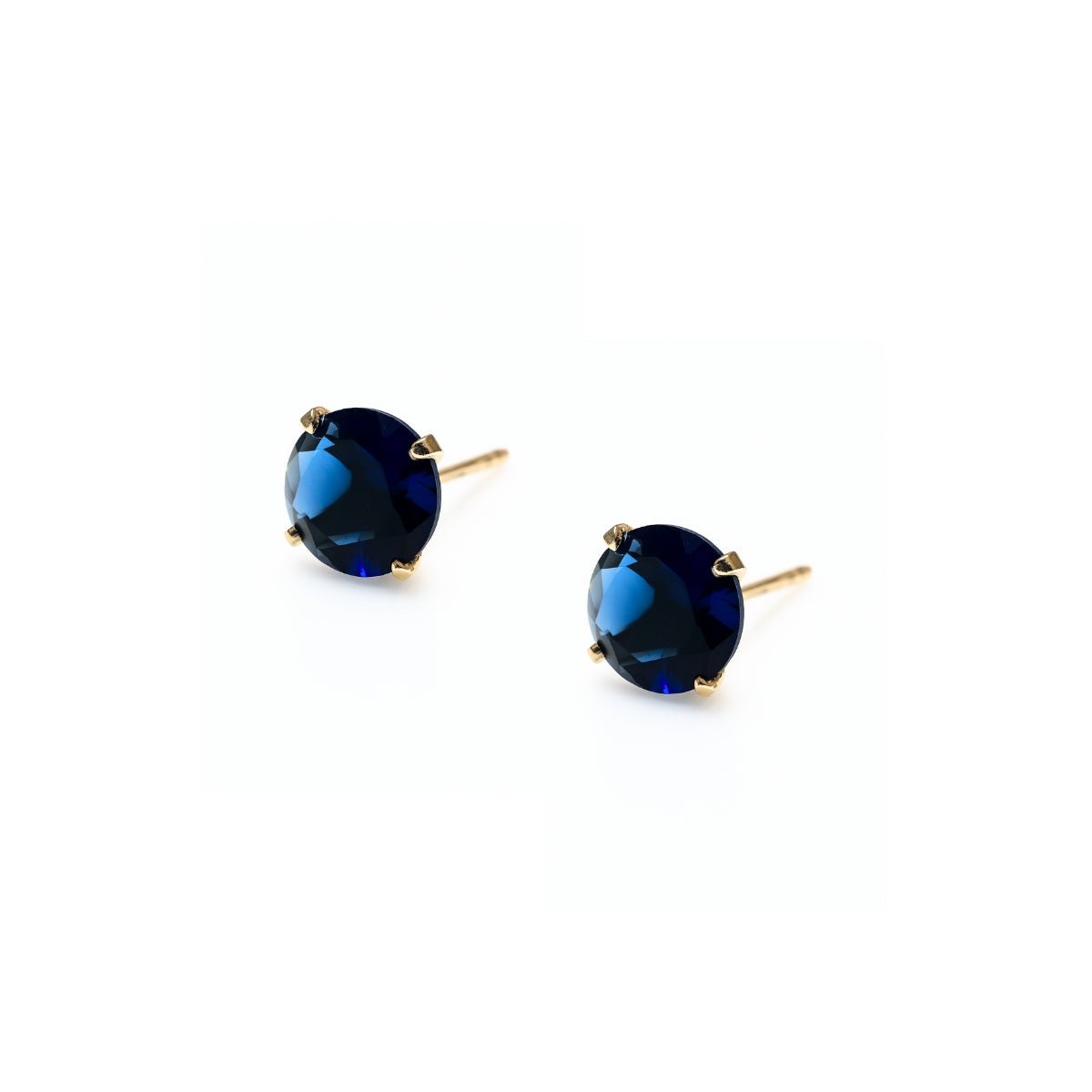 aretes punto de luz con circonita cubica azul elaborado en oro laminado de AMBAR Joyería