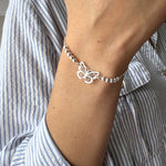 pulsera mariposa calada en modelo con sistema regulable elaborada en plata 925 de AMBAR Joyería Fina