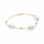 Pulsera de cadena fina en oro 18k con tres perlas barrocas blancas de forma orgánica, accesorio de joyería fina para mujer.
