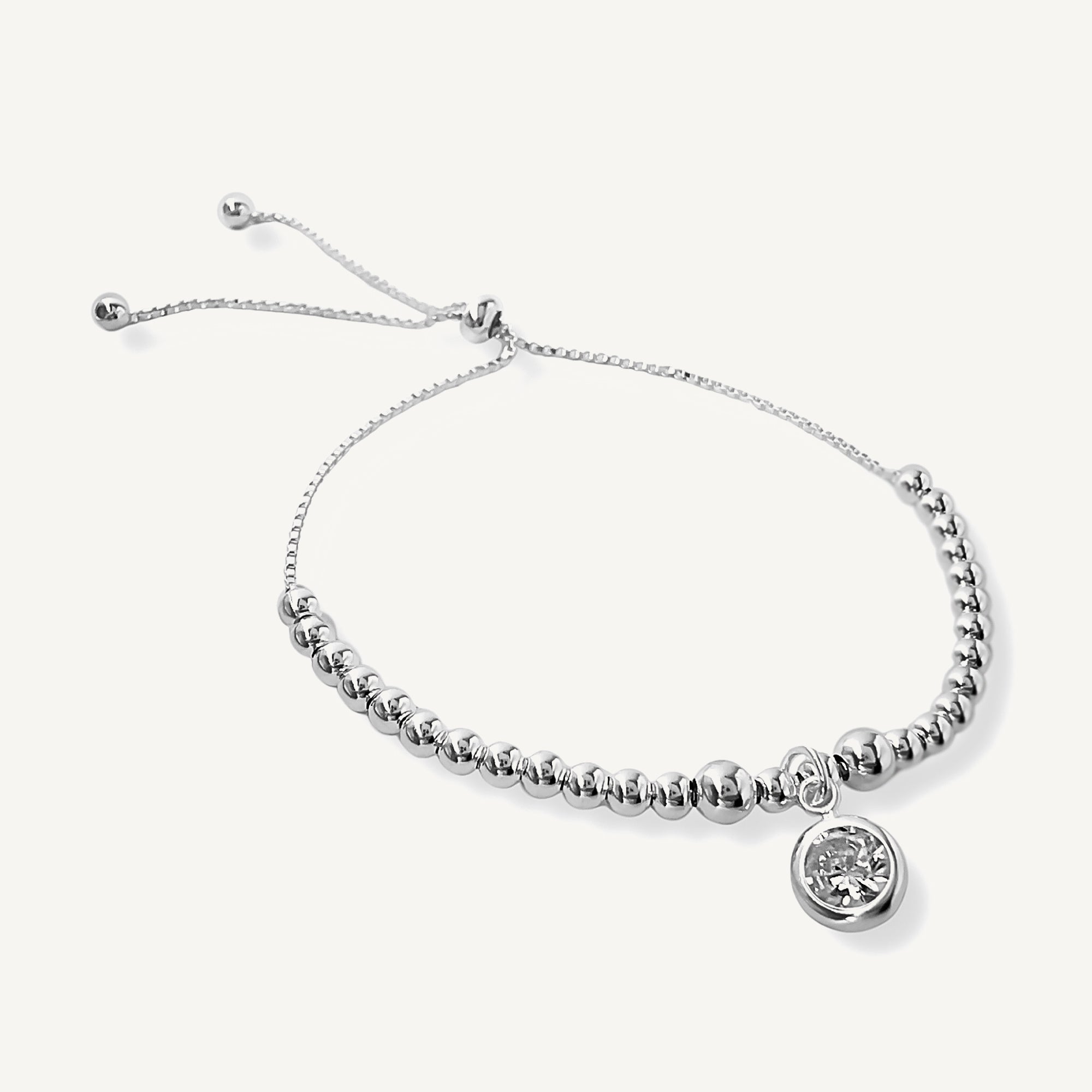 Pulsera anika con dije de punto de luz cristal con sistema regulable elaborado en plata 925 por AMBAR joyería 