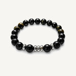 Pulsera Element Grand Obsidiana con piedra natural de obsidiana de 10 mm y donas de acero inoxidable.