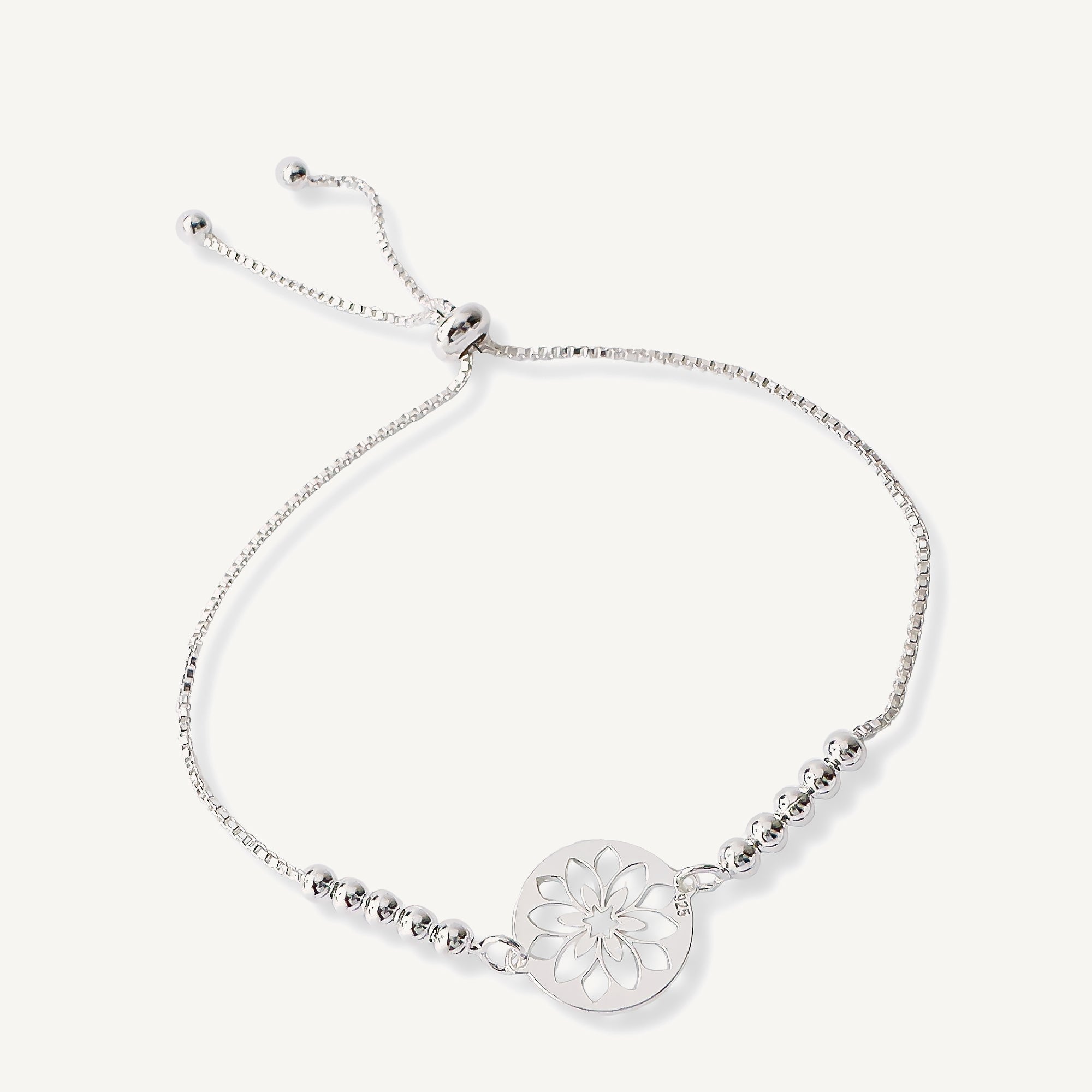 pulsera flor calada con sistema  regulable elaborada en plata 925 de AMBAR Joyería Fina