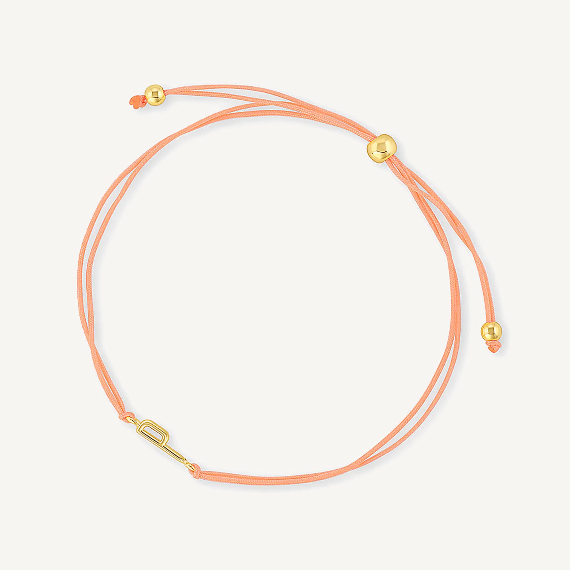 Pulsera hilo nude con inicial  p enchapada en oro 18K de AMBAR joyería fina