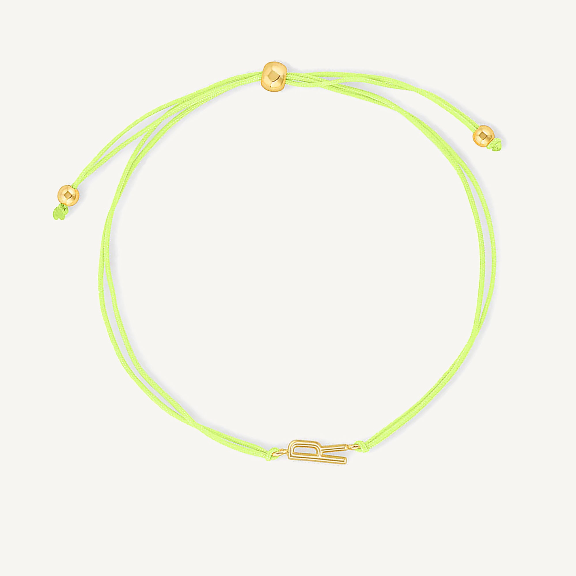 Pulsera hilo amarillo con inicial  r enchapada en oro 18K de AMBAR joyería fina