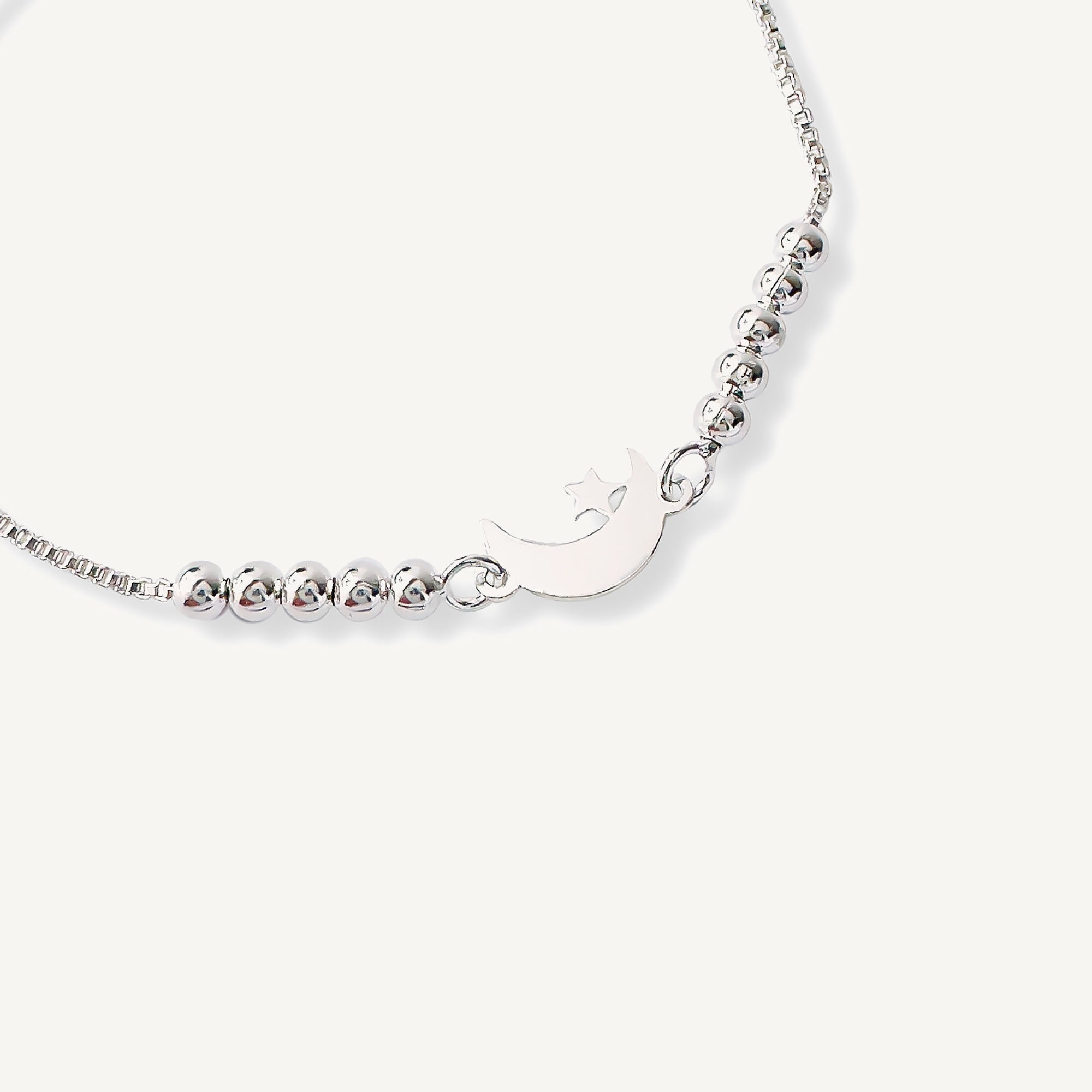 pulsera lunita y estrella con sistema  regulable al detalle elaborada en plata 925 de AMBAR Joyería Fina