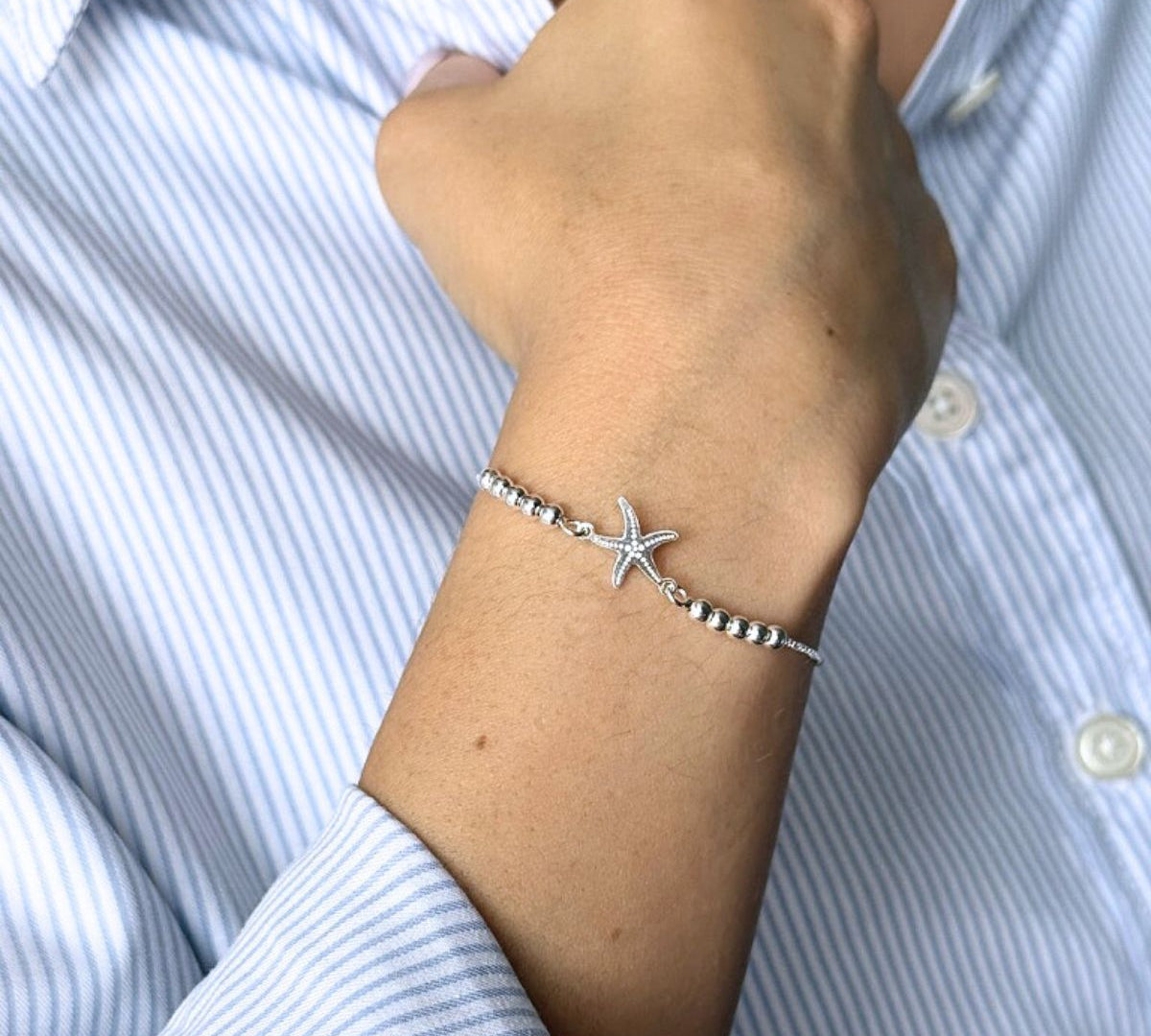Pulsera estrella de mar con sistema regulable en modelo elaborada en plata 925 de AMBAR joyería fina