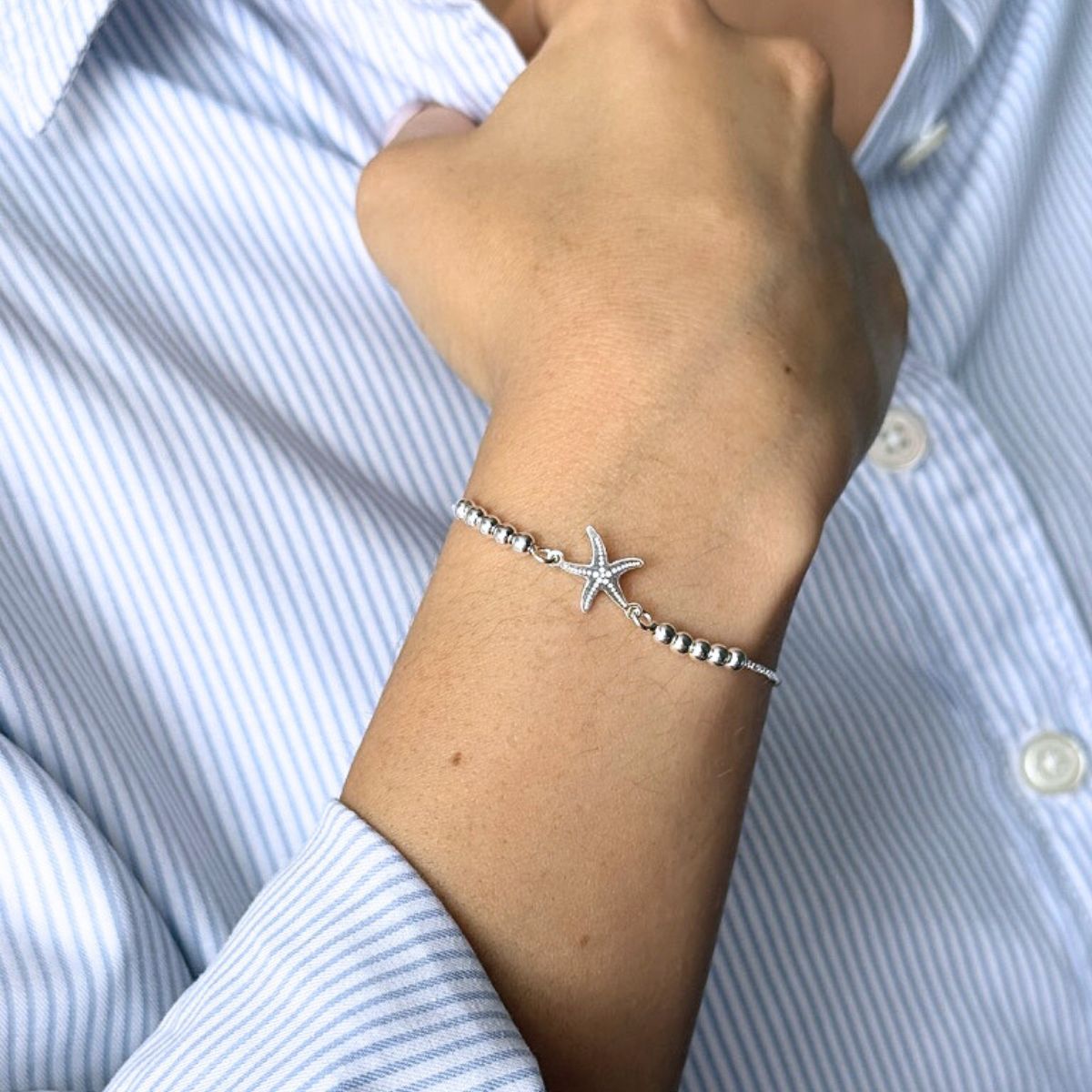 Pulsera estrella de mar con sistema regulable en modelo elaborada en plata 925 de AMBAR joyería fina