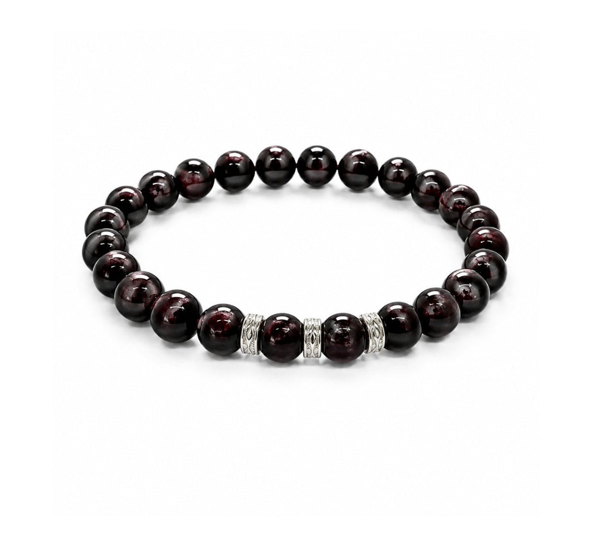 Pulsera elástica para hombre modelo Hermes con hilo de silicona, esferas de rodonita borgoña y tres aros texturizados de plata 925 sobre fondo blanco.