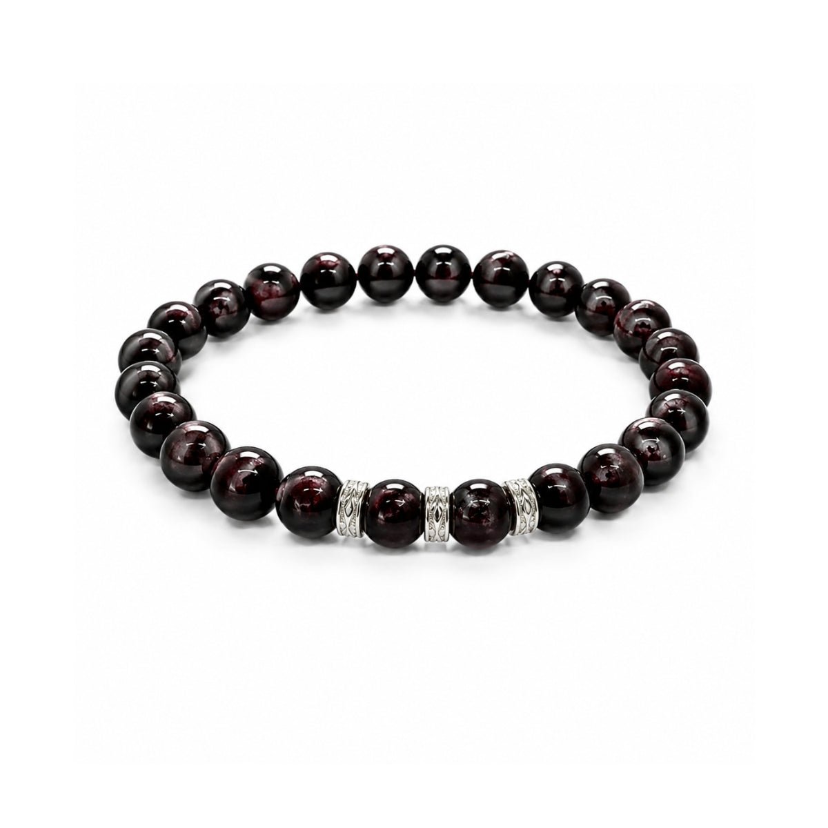 Pulsera elástica para hombre modelo Hermes con hilo de silicona, esferas de rodonita borgoña y tres aros texturizados de plata 925 sobre fondo blanco.