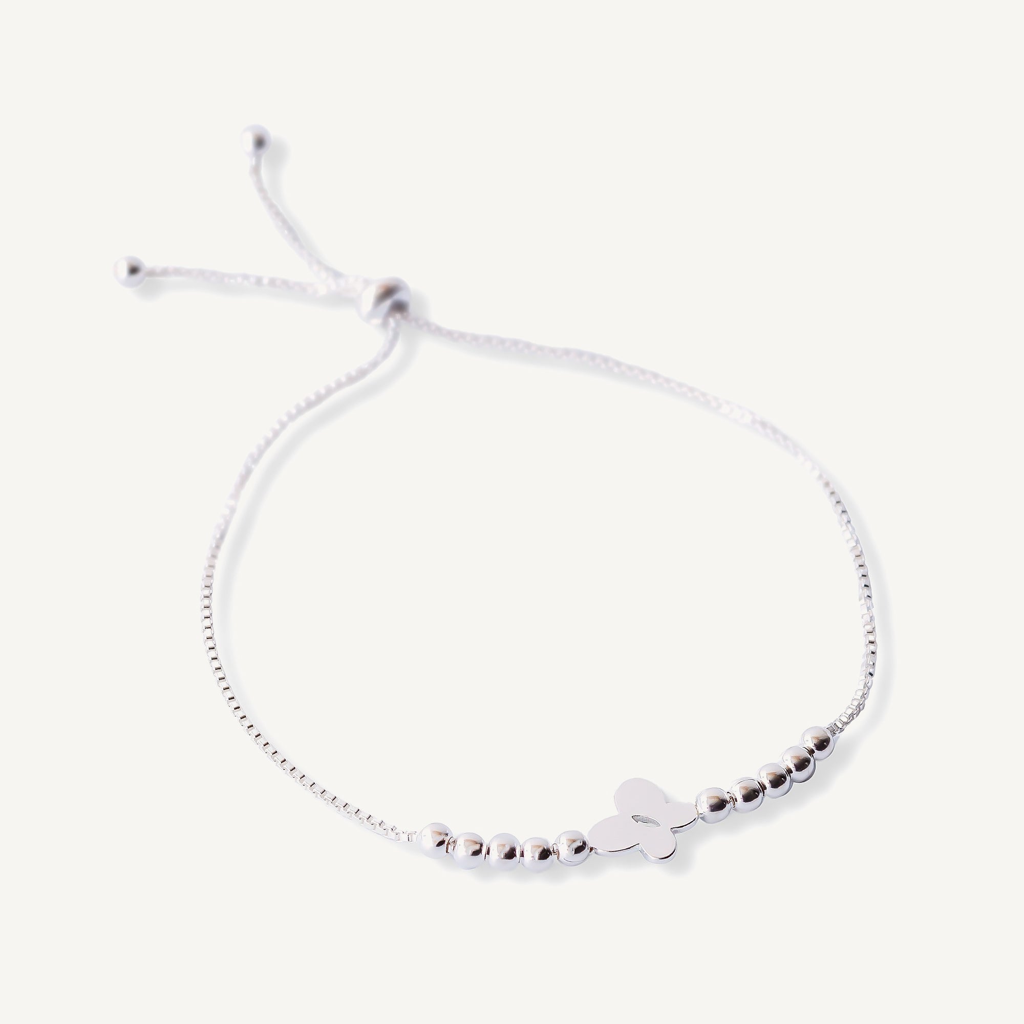 pulsera mariposita plana con bolitas y sistema regulable elaborada en plata 925 de AMBAR Joyería Fina