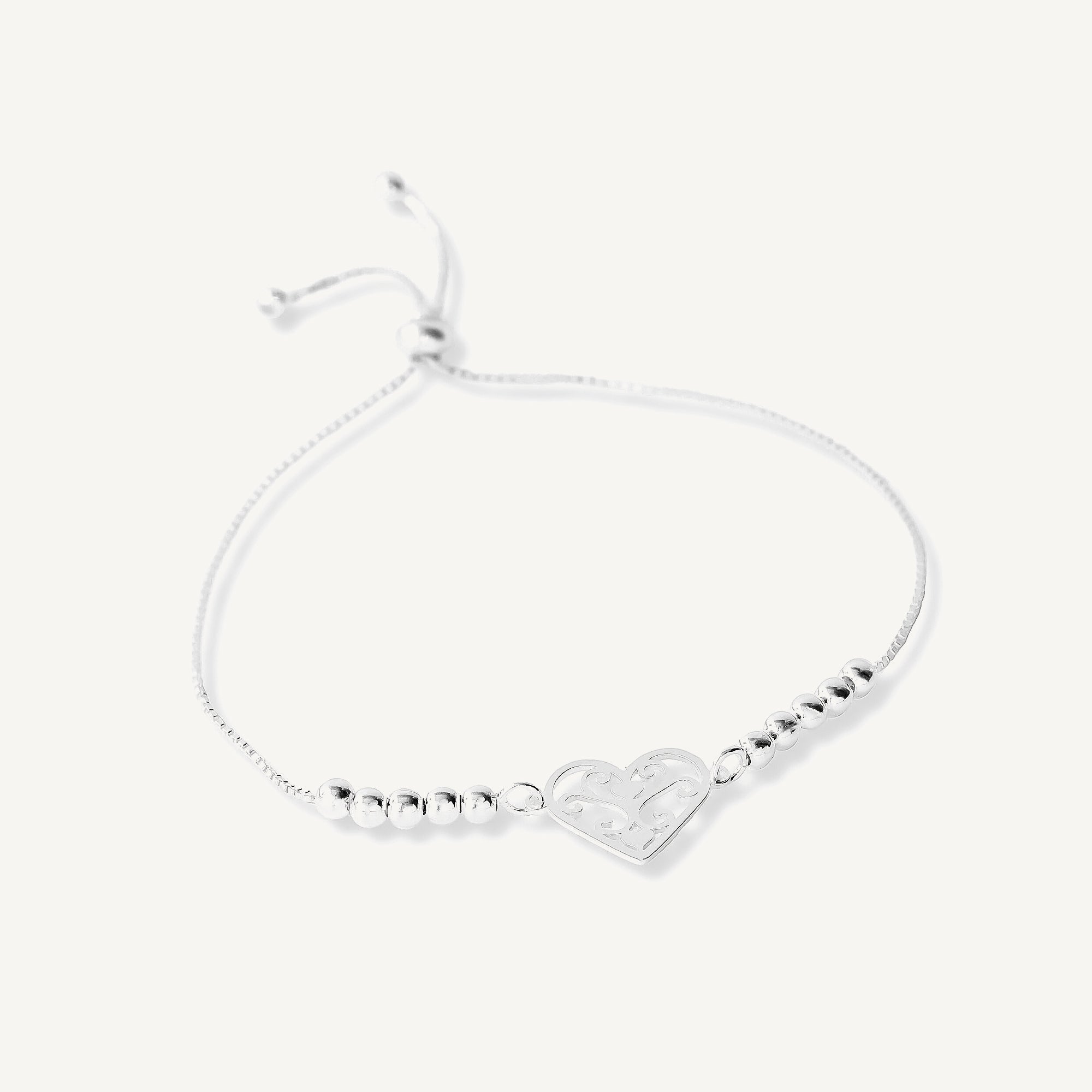 pulsera con sistema regulable y dije de corazones 3 en 1 elaborada en plata 925 de AMBAR Joyería Fina