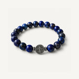 Pulsera San Benito Grand Lapislázuli con piedra natural de 10 mm y dije de San Benito en plata 950.
