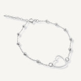 Pulsera Satelite con corazon calado y bolitas elaborado en plata 925 para AMBAR joyería