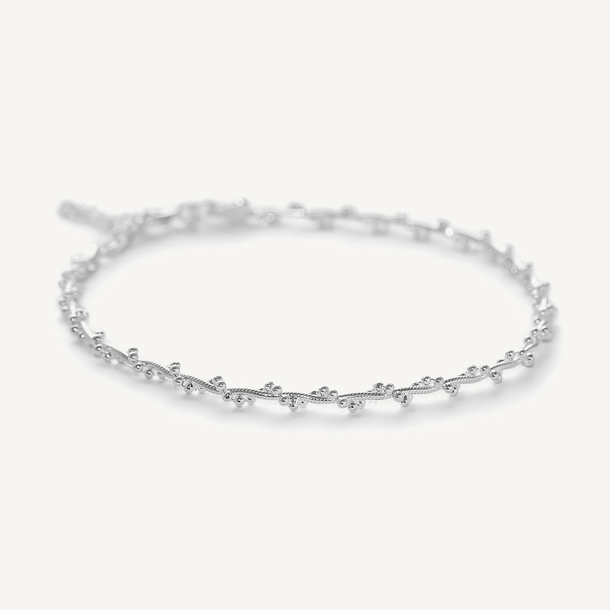 pulsera trenzada con bolitas con extension elaborada en plata 925 de AMBAR joyería