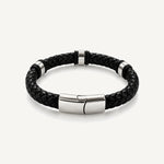 Pulsera Cuero Trenzado Urban de cuero negro con broche y accesorios de acero inoxidable y bandas de silicona negra.